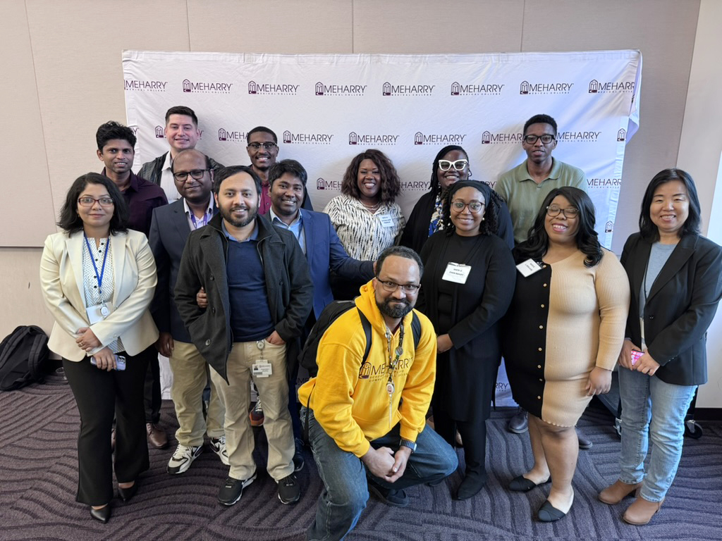 A group of SACS students and faculty at the Research Symposium.