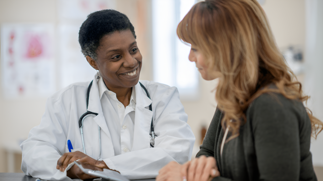 A woman and a man in a medical setting.