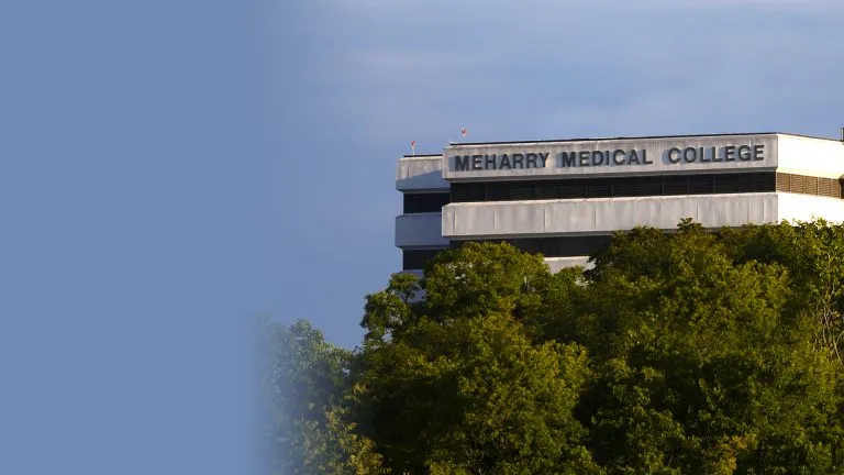 A building with a sign that reads "MERRY MEDICAL COLLEGE" in the background.