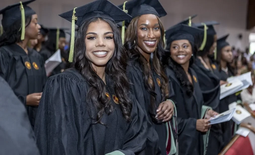 Group of graduates in caps and gowns.