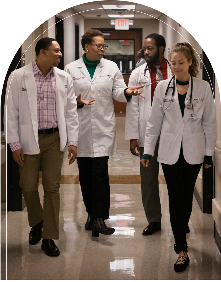 A group of doctors in a hallway.
