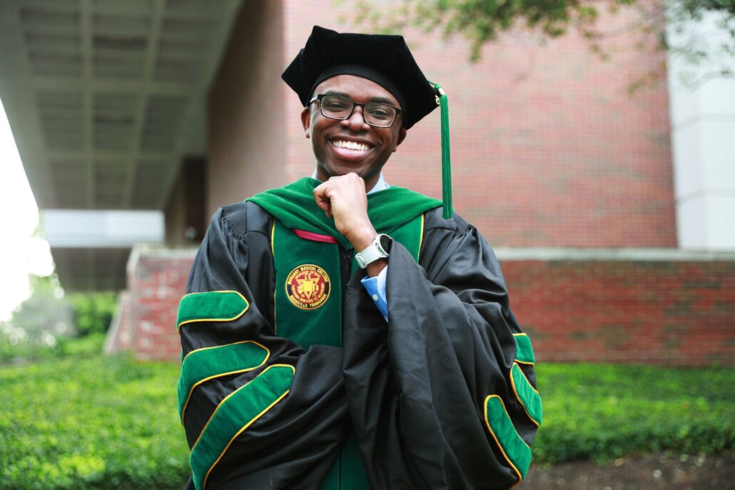 Man in graduation cap and gown.