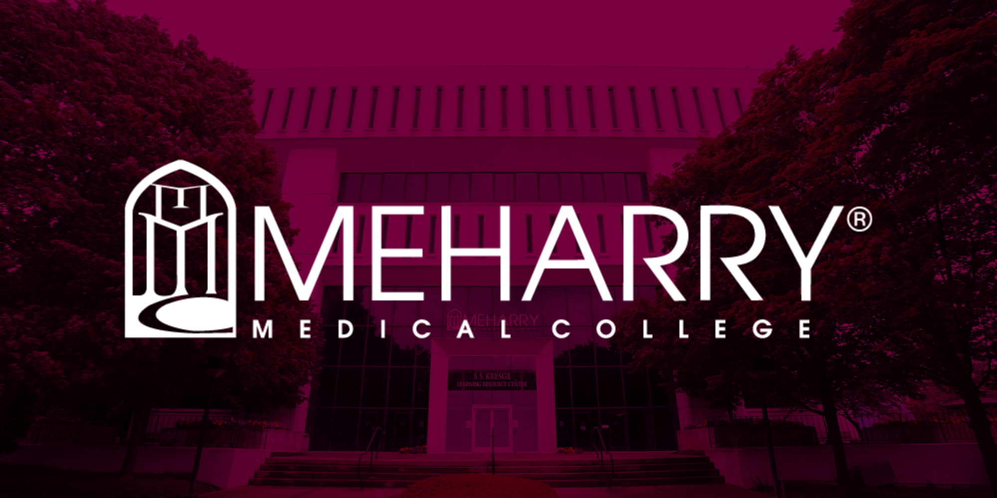 Image of a college building with a red sky background.