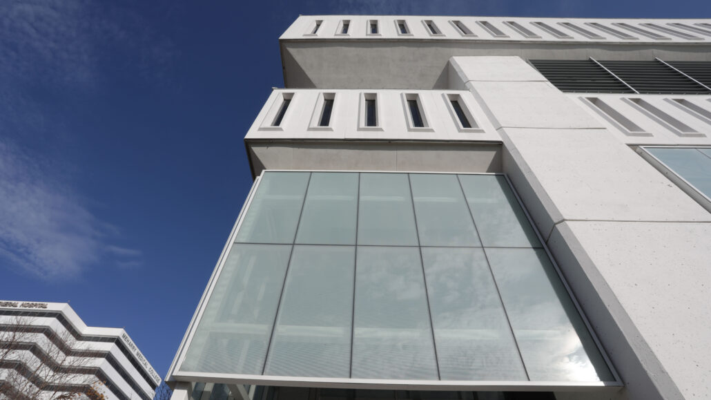 Modern building with large windows and a flat roof.