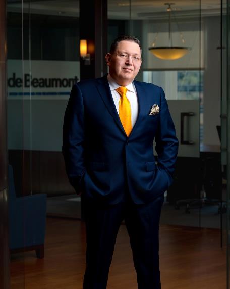 Man in suit standing in office.