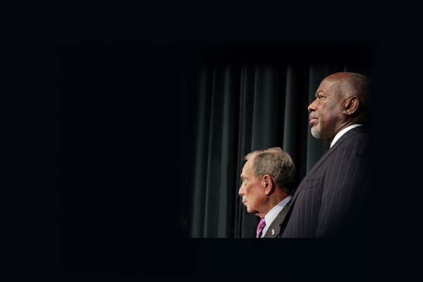 Two men standing at a podium.