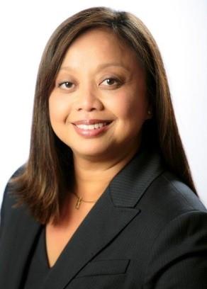 Woman in suit posing for portrait.