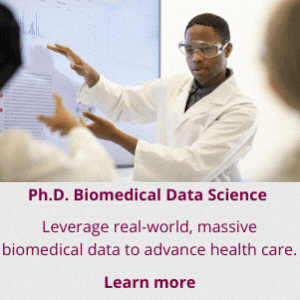 A person in a lab coat giving a presentation.