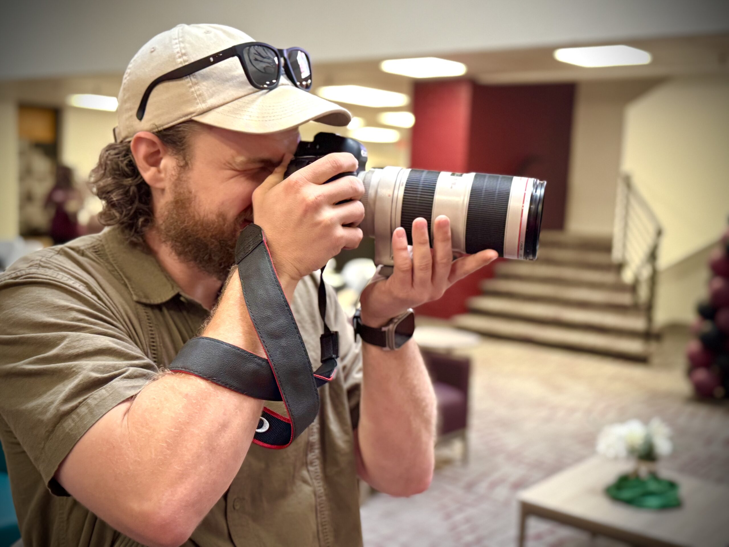 Man taking a photo with a camera.