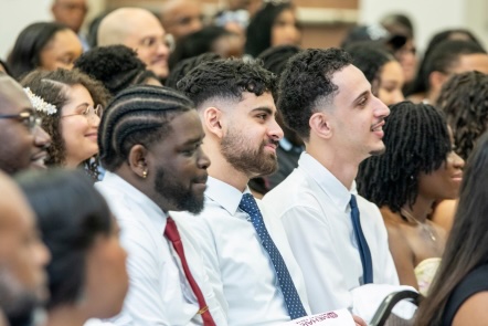 A group of people sitting in a church.
