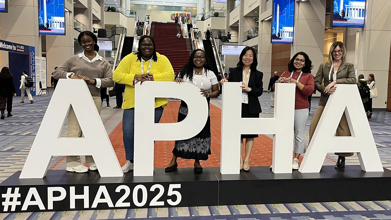 Dr. Cao with students at APHA Conference