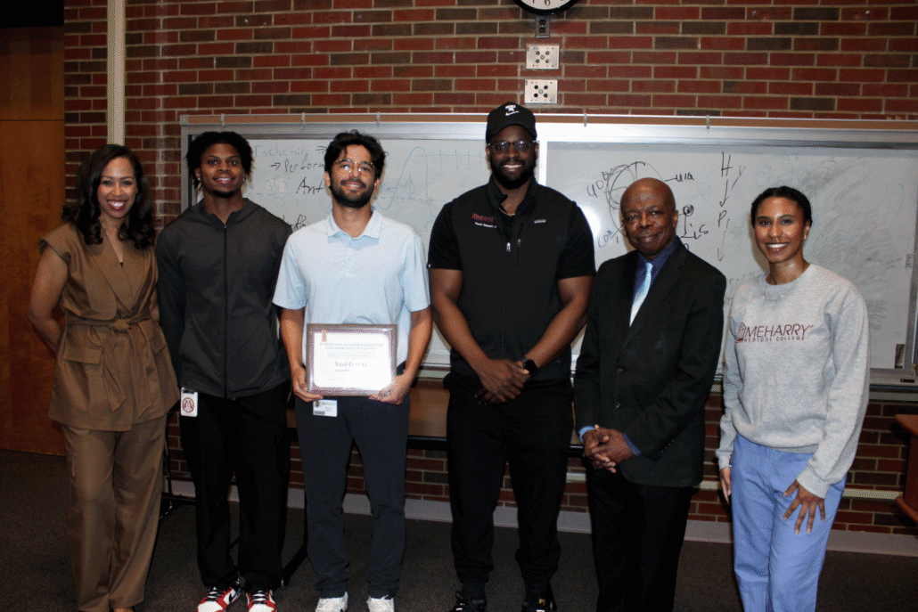 Saul Garcia posing for a photo with his family