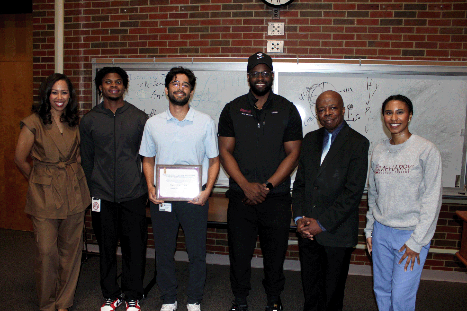 Saul Garcia posing for a photo with his family