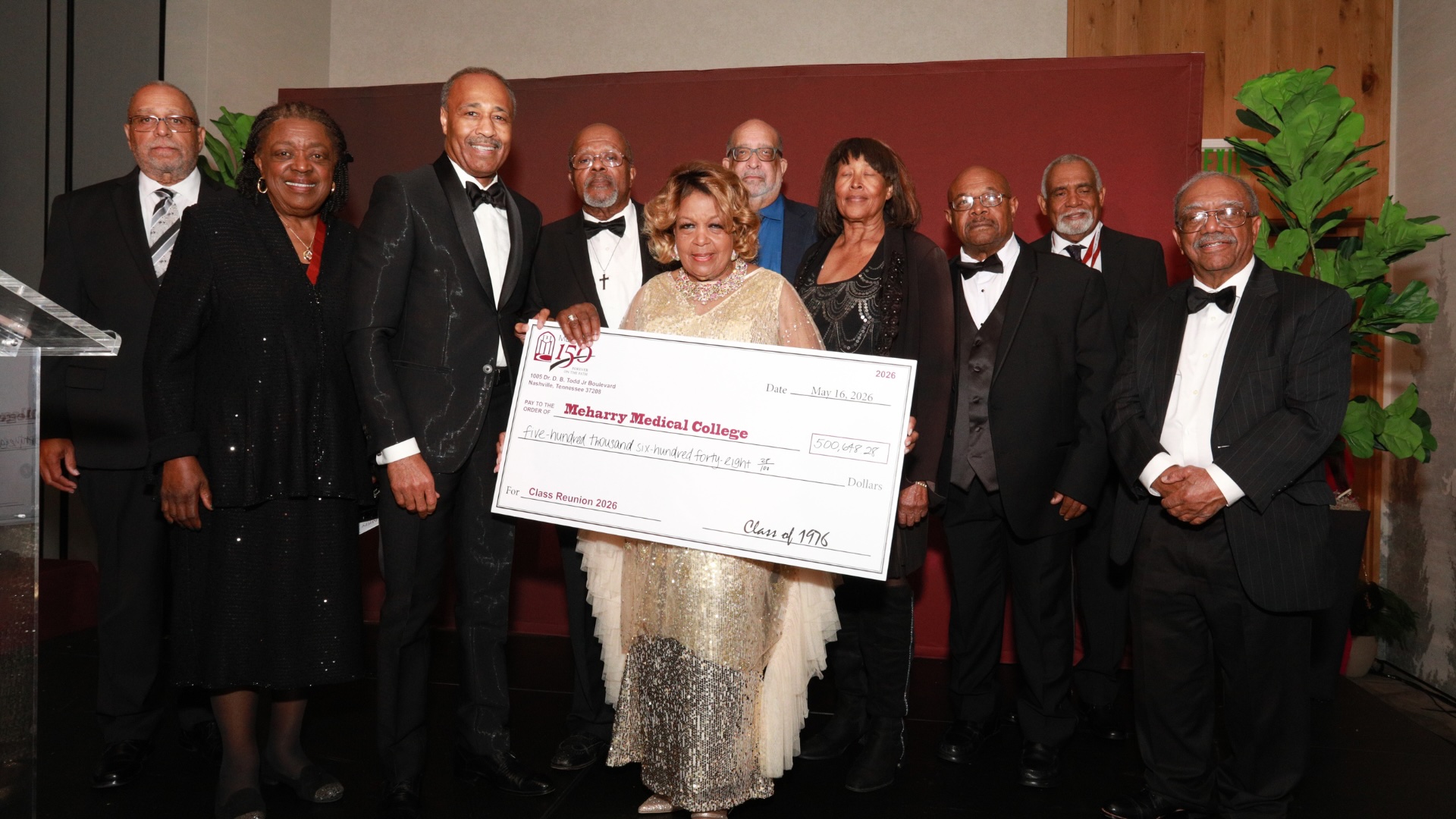 Class of 1976 presenting their class check.