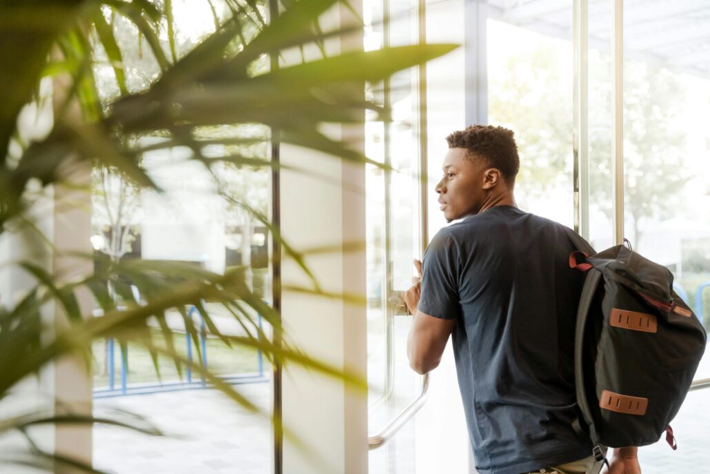 Student opening door