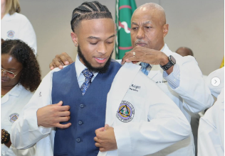 Student receives white coat